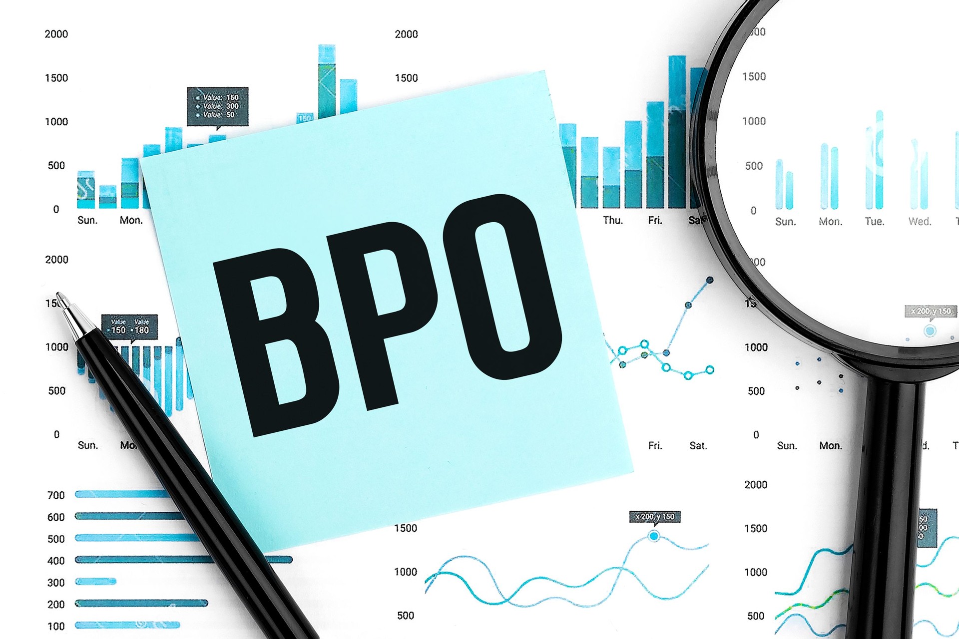 Text BPO Business Process Outsourcing on blue sticker, magnifier, pen, graphs. Business flat lay.